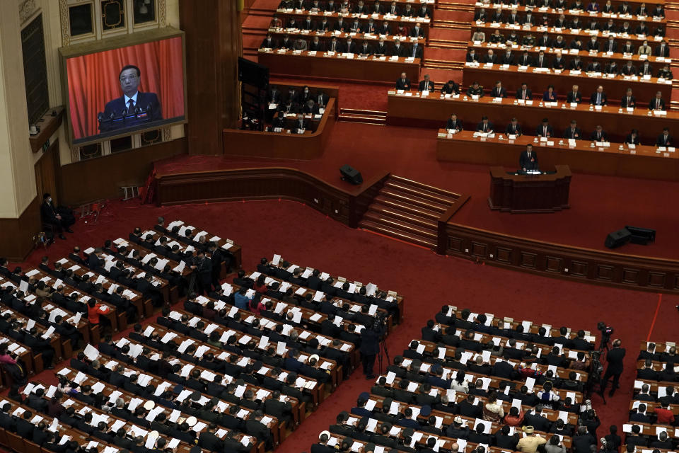 Chinese Premier Li Keqiang speaks during the opening session of China's National People's Congress (NPC) at the Great Hall of the People in Beijing, Friday, March 5, 2021. China’s No. 2 leader has set a healthy economic growth target and vowed to make this nation self-reliant in technology amid tension with Washington and Europe over trade and human rights. (AP Photo/Andy Wong)