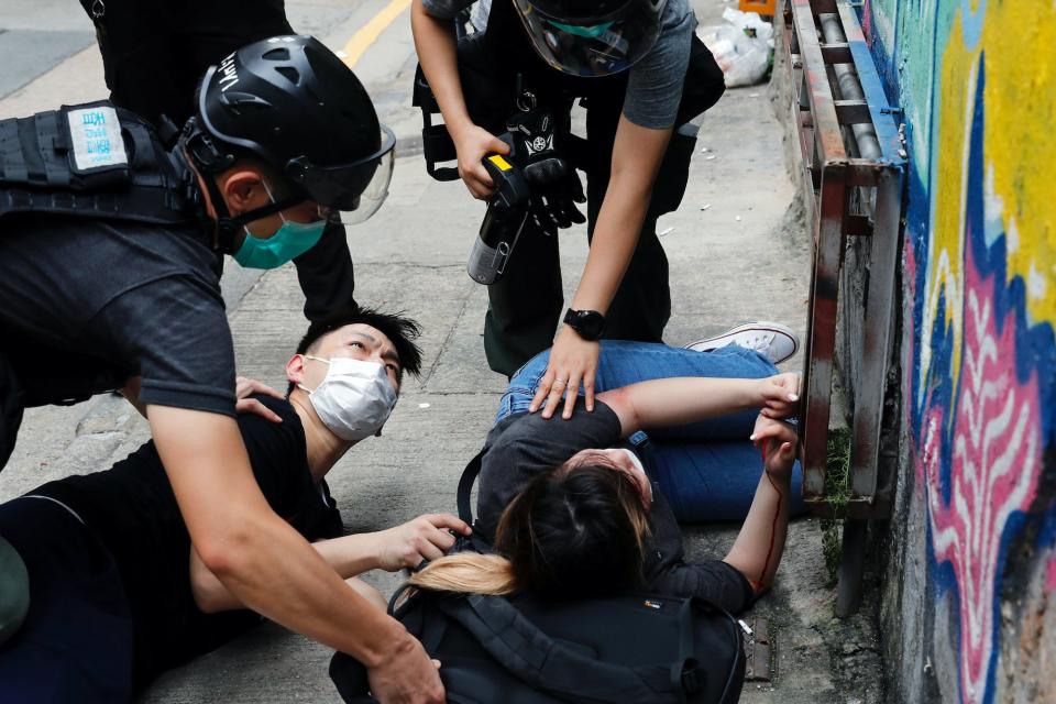 People detained by riot police.JPG