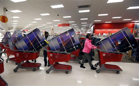 Thanksgiving Day holiday shoppers line up with television sets on discount at the Target retail store in Chicago, Illinois in this November 28, 2013 file photo. REUTERS/Jeff Haynes/Files