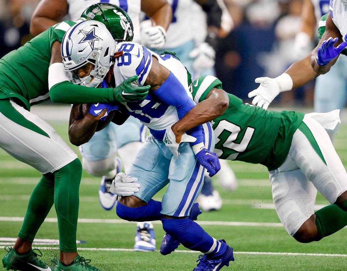 The New York Jets defense attempts to stop Dallas Cowboys wide receiver CeeDee Lamb on Sunday at AT&T Stadium. Lamb finished the game with 11 receptions for 143 yards.