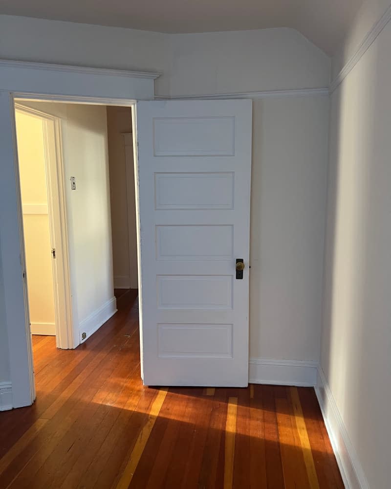 White walls in bedroom before painting.