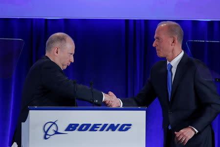 Boeing Co Vice-President and Corporate Secretary Grant Dixton (L), introduces Boeing Co Chief Executive Dennis Muilenburg at the general annual shareholder meeting at the Field Museum in Chicago, Illinois, U.S., April 29, 2019. Jim Young/Pool via REUTERS