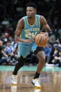 Charlotte Hornets forward Brandon Miller brings the ball upcourt against the Dallas Mavericks during the first half of an NBA basketball game Tuesday, April 9, 2024, in Charlotte, N.C. (AP Photo/Jacob Kupferman)