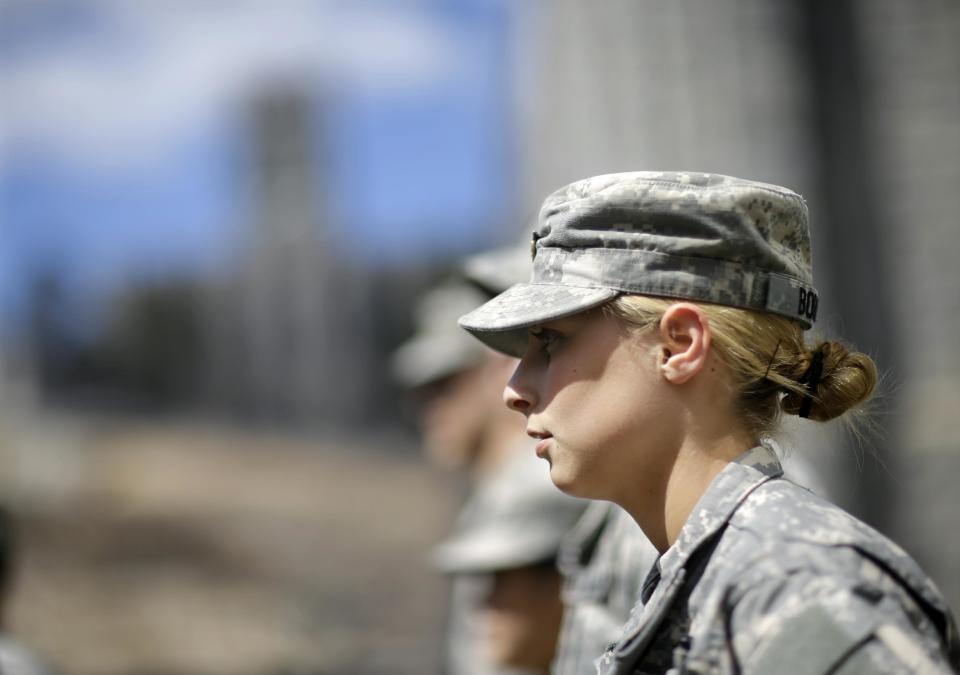 In this April 9, 2014 photo, West Point cadet Austen Boroff, of Chatham, N.J., stands in a row of cadets as she waits to march to lunch at the United States Military Academy in West Point, N.Y. With the Pentagon lifting restrictions for women in combat jobs, Lt. Gen. Robert Caslen Jr. has set a goal of boosting the number of women above 20 percent for the new class reporting this summer. (AP Photo/Mel Evans)