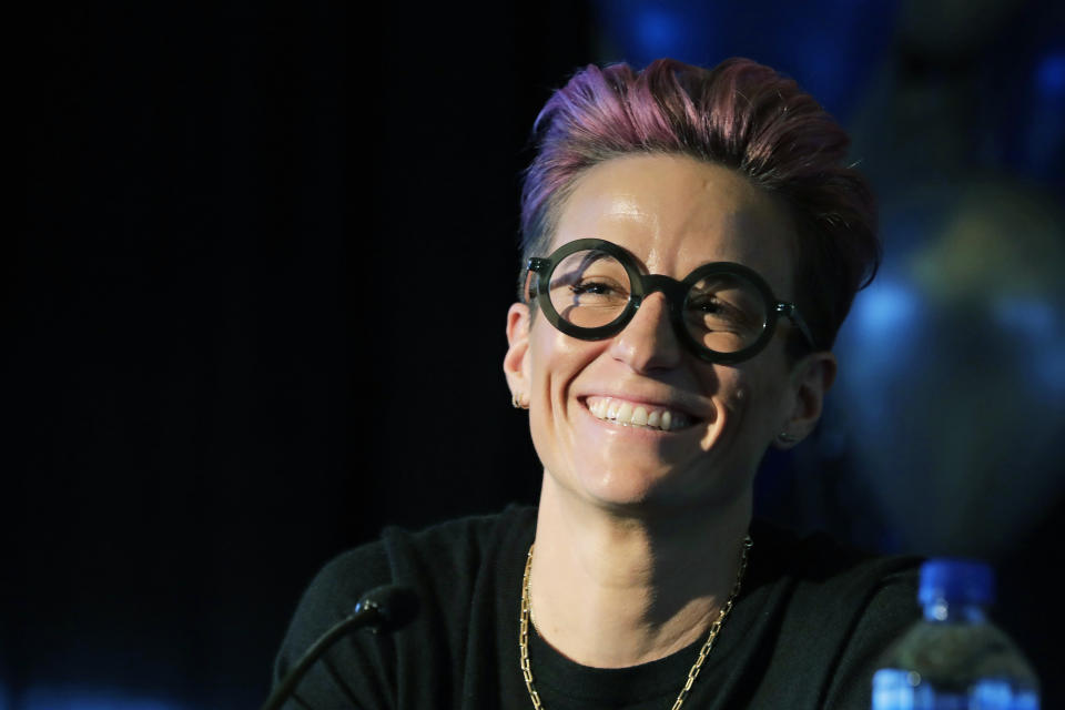 Megan Rapinoe, a forward with the National Women's Soccer League's Reign FC and the U.S. Women's National Team, smiles Thursday, Dec. 19, 2019, during a news conference to announce that OL Groupe, the parent company of Olympique Lyonnais, is buying Reign FC in a transaction expected to close in January 2020. Reign FC will continue to play its home games at Cheney Stadium, the venue it shares with the Triple-A minor league baseball team the Tacoma Rainiers. (AP Photo/Ted S. Warren)