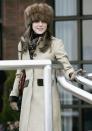 <p>Wearing a Russian-style fur hat to the final day of Cheltenham Races in England.<br></p>