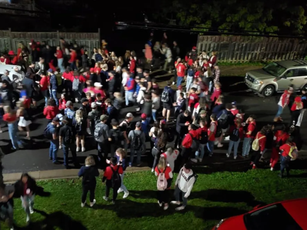 Students from Acadia University took their homecoming celebrations off campus Saturday night, roaming around the town's streets, raising the ire of some in the community and attention from police. (Submitted by Angie Jenkins - image credit)