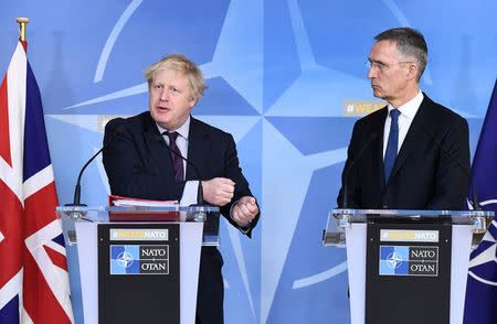 British Foreign Secretary Boris Johnson and NATO Secretary-General Jens Stoltenberg hold a joint news conference after their meeting at the Alliance headquarters in Brussels, Belgium, March 19, 2018. REUTERS/Stringer