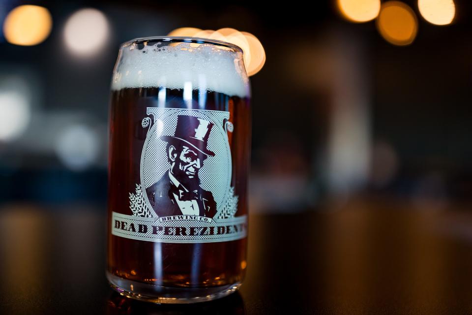 Owner Albert Perez pours a cup of the Gipper Amber on the opening day of his new bar, Dead Perezidents Brewing Co., in Central El Paso, located at 3002 Pershing, on Thursday, Jan. 25, 2024.