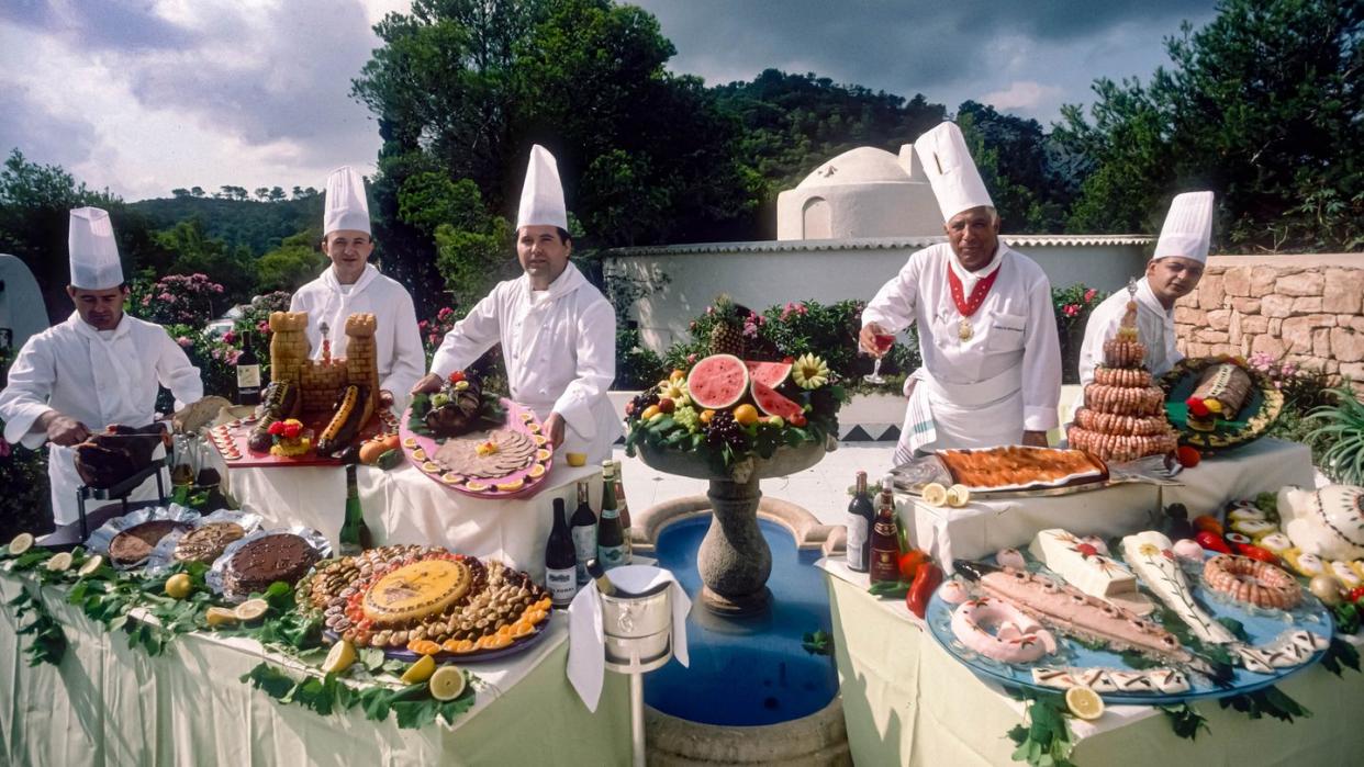 a group of chefs preparing food