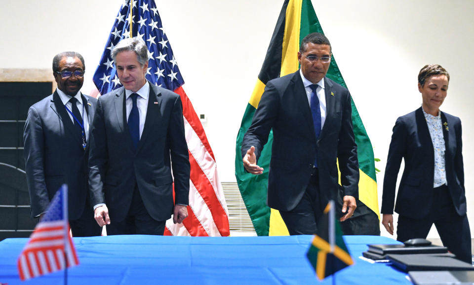 Secretary of State Antony Blinken, poses for a photo with Jamaica's Foreign Minister Kamina Johnson Smith, right, Jamaica's Prime Minister Andrew Holness and U.S. Ambassador to Jamaica N. Nick Perry, left, during a meeting on Haiti at the Conference of Heads of Government of the Caribbean Community (CARICOM) in Kingston, Jamaica, on Monday, March 11, 2024. (Andrew Caballero-Reynolds, Pool via AP)