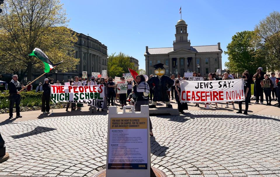 A group of more than 100 residents — including students from Iowa City High and members of an Iowa City Students for Justice in Palestine rally — gathered on the Pentacrest at 3:30 p.m. on Friday to protest the Israel-Hamas War.