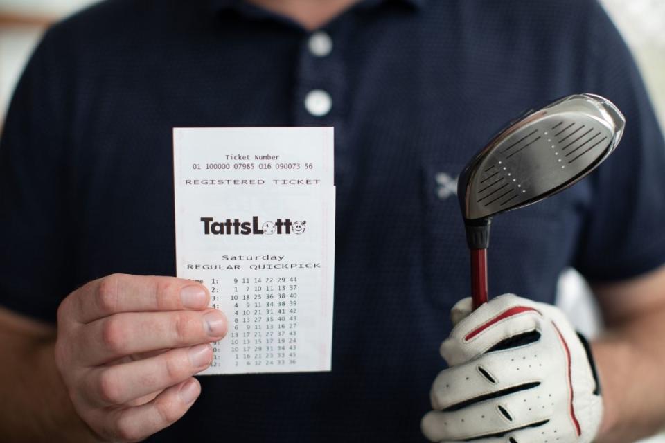 TattsLotto winner holds winning ticket and golf club. Source: The Lott