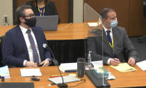 In this image from video, defense attorney Eric Nelson, left, and defendant, former Minneapolis police officer Derek Chauvin, right, listen Monday, April 12, 2021, as Hennepin County Judge Peter Cahill presides over motions in the trial of Chauvin at the Hennepin County Courthouse in Minneapolis. Chauvin is charged in the May 25, 2020 death of George Floyd. (Court TV, via AP, Pool)