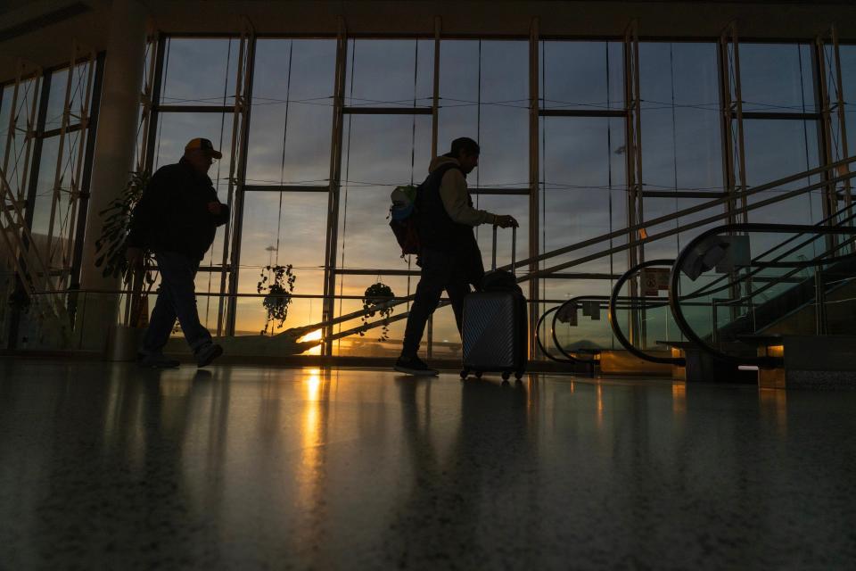 Travelers head to the parking garage at Terminal C at Newark Liberty Airport in Newark, NJ on Tuesday Nov. 21, 2023. Thanksgiving week is one of the busiest travel days in the United States.