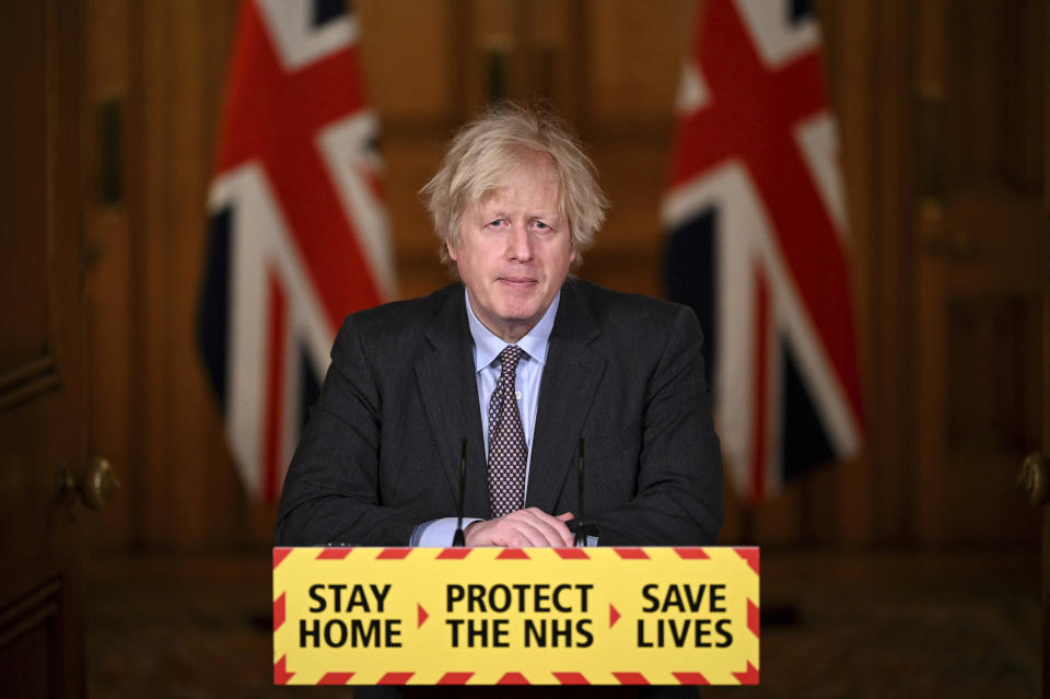 Britain's Prime Minister Boris Johnson speaks during a televised press conference at 10 Downing Street in London, Monday, Feb. 22, 2021. Johnson has announced a gradual easing of one of Europe’s strictest lockdowns, saying children will return to class and people will be able to meet a friend for coffee in a park in two weeks’ time. But people longing for a haircut, a restaurant meal or a pint in a pub have almost two months to wait, and people won’t be able to hug loved ones that they don’t live with until May at the earliest. (Leon Neal/Pool Photo via AP)