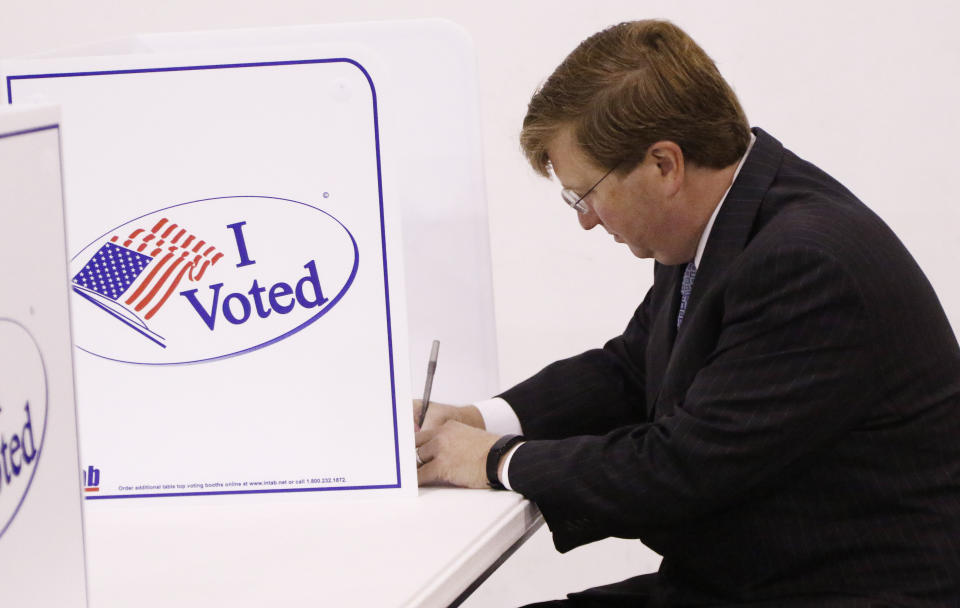 Lt. Gov. Tate Reeves casts his vote at a small voting kiosk in his Flowood, Miss., precinct, Tuesday, Aug. 27, 2019. Reeves is in a runoff for the Republican Party nomination for governor against former Mississippi Supreme Court Chief Justice Bill Waller Jr. (AP Photo/Rogelio V. Solis)