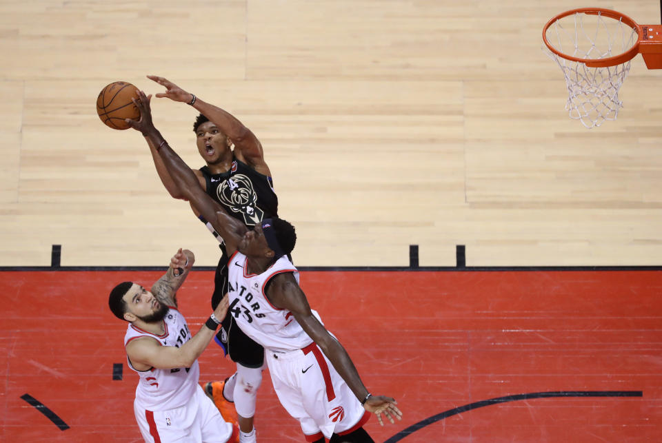 Toronto Raptors forward Pascal Siakam #43 blocks Milwaukee Bucks forward Giannis Antetokounmpo #34 on his way to the rim as Fred VanVleet watches. The Toronto Raptors beat the Bucks in Game 6 to win the NBA Eastern Conference Final in Toronto. (Photo by Steve Russell/Toronto Star via Getty Images)