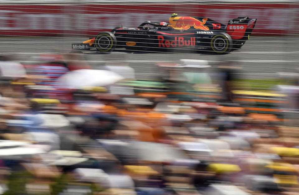 In this March 16, 2019, file photo, Red Bull driver Pierre Gasly of France races past the crowd during the third practice session for the Australian Grand Prix in Melbourne, Australia. The start of the 2021 Formula One season has been delayed after the Australian Grand Prix was postponed because of the coronavirus pandemic. The Australian race in Melbourne has been rescheduled from March 21 to November 21. (AP Photo/Andy Brownbill, File)