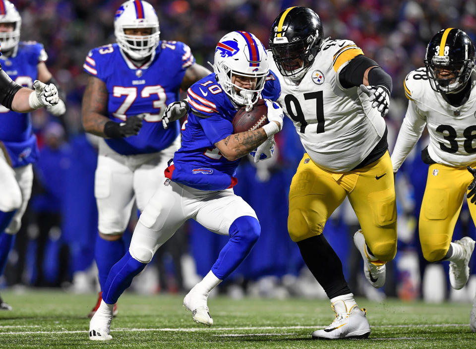 Buffalo Bills wide receiver Khalil Shakir (10) carries the ball for a touchdown against the Pittsburgh Steelers during the fourth quarter of an NFL wild-card playoff football game, Monday, Jan. 15, 2024, in Buffalo, N.Y. (AP Photo/Adrian Kraus)