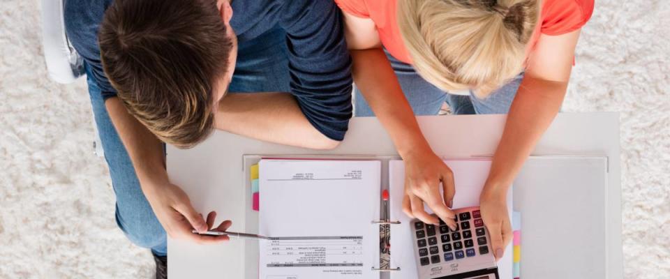 young couple reviewing finances