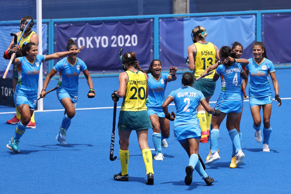 TOKYO, JAPAN - AUGUST 02: Gurjit Kaur of Team India celebrates scoring the first goal with teammates while Karri Somerville and Edwina Bone of Team Australia walk away during the Women's Quarterfinal match between Australia and India on day ten of the Tokyo 2020 Olympic Games at Oi Hockey Stadium on August 02, 2021 in Tokyo, Japan. (Photo by Buda Mendes/Getty Images)