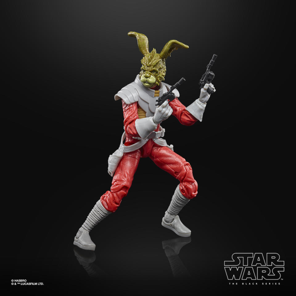 A Jaxxon Rabbit Hasbro Star Wars Black Series figure, out of the box and holding two blasters