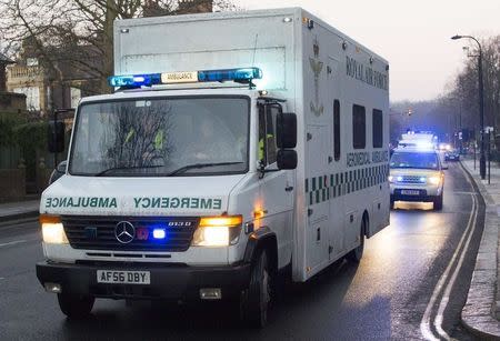 A convoy carrying a female Ebola patient arrives at the Royal Free Hospital in London December 30, 2014. REUTERS/Neil Hall