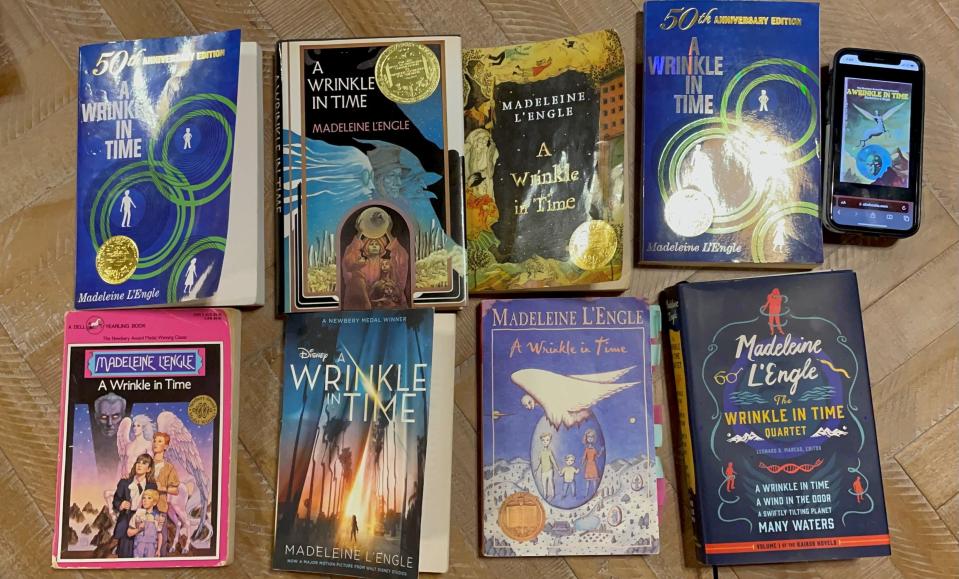 All the different covers of "A Wrinkle in Time" brought to a book club meeting.