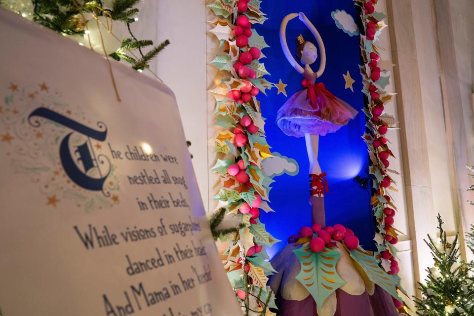 Holiday decorations adorn the Cross Hall of the White House for the 2023 theme "Magic, Wonder, and Joy," Monday in Washington.