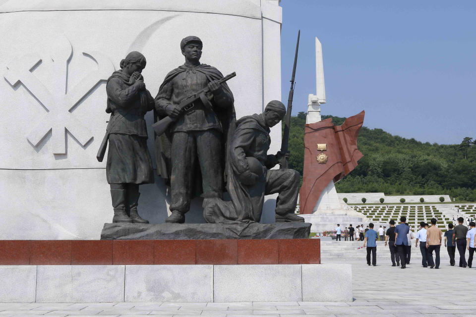 Pyongyang citizens visit the Fatherland Liberation War Martyrs Cemetery in Pyongyang, North Korea, Tuesday, July 27, 2021 to mark the Korean War armistice anniversary. The leaders of North and South Korea restored suspended communication channels between them and agreed to improve ties, both governments said Tuesday, amid a 2 ½ year-stalemate in U.S.-led diplomacy aimed at stripping North Korea of its nuclear weapons. (AP Photo/Jon Chol Jin)