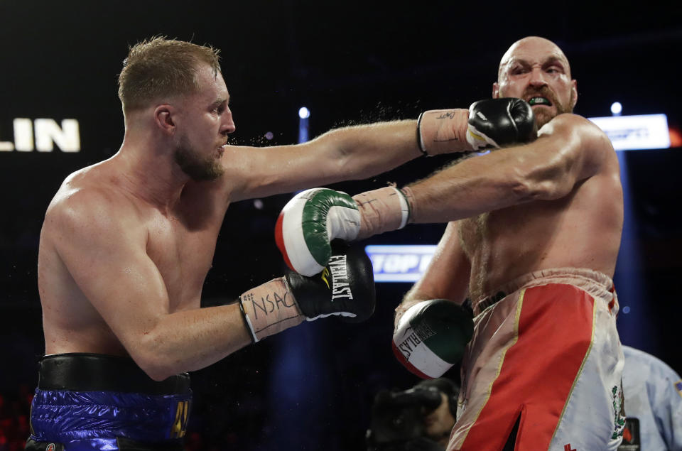 Otto Wallin, left, of Sweden, punches Tyson Fury, of England, during their heavyweight boxing match Saturday, Sept. 14, 2019, in Las Vegas. (AP Photo/Isaac Brekken)