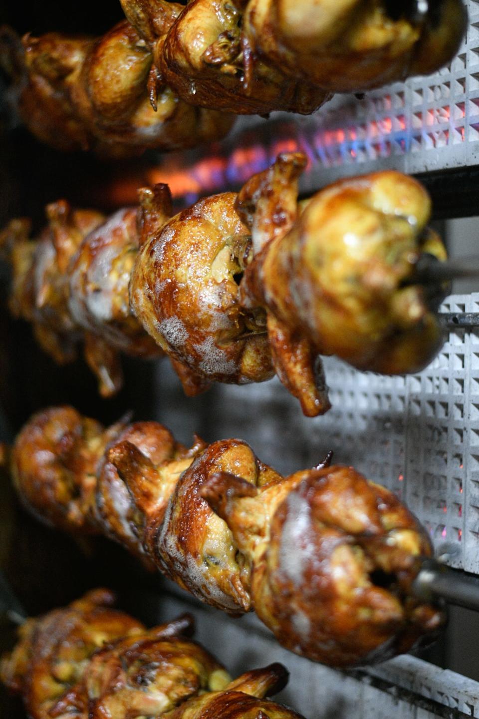 Chicken cooking in the roasters of Pollos Bros. on Mains Street in Hesperia. (James Quigg for the Daily Press)