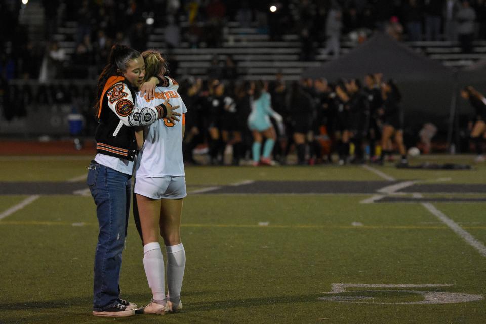Apple Valley's Kyleigh Fuller, left, hugs Samantha Most at the end of the CIF State Southern California Regional Division 3 championship game on Saturday, March 2, 2024. Apple Valley lost to Granada Hills Charter in penalty kicks.