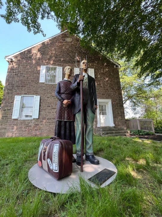 "God Bless America," Seward Johnson's depiction of the famous painting, "American Gothic," is on display at the Patterson Farm near the Artists of Yardley headquarters off Mirror Lake Road in Lower Makefield.