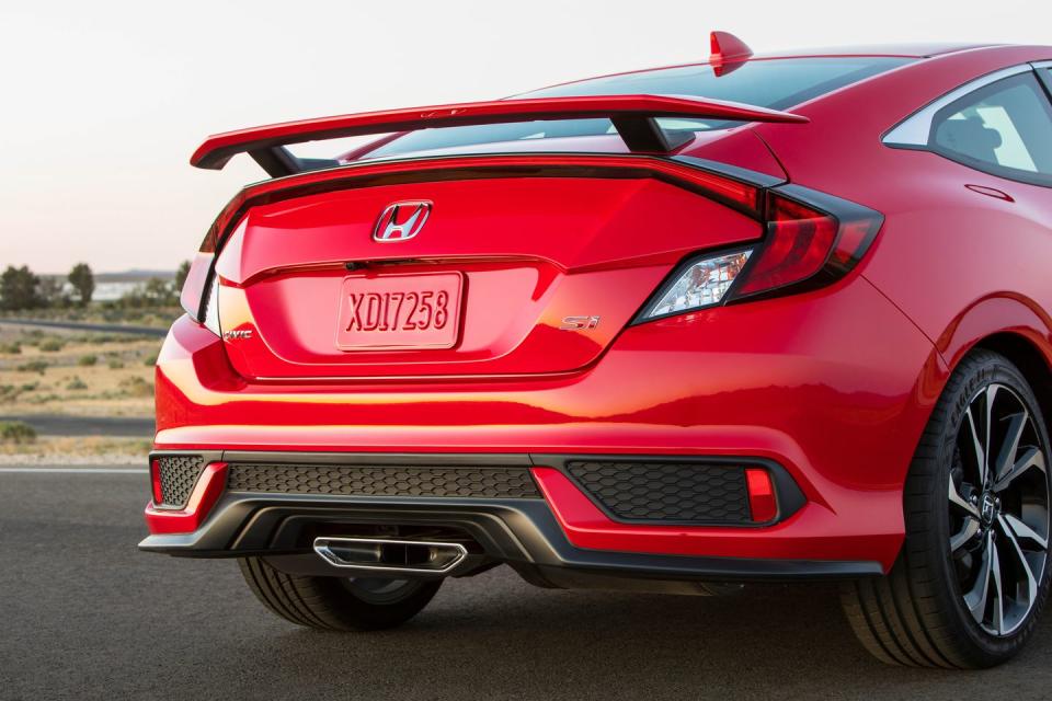 <p>No sport compact embodies the breed’s culture quite like the Civic Si. Aware of this, clearly, Honda slaps a prominent wing onto the Si coupe and a somewhat subtler version on the Si sedan.</p>