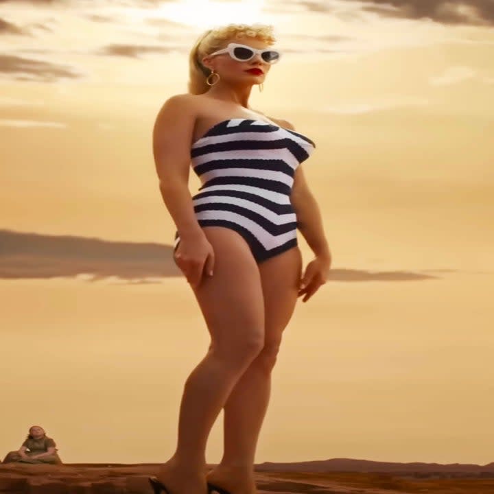 margot robbie in the striped swimsuit