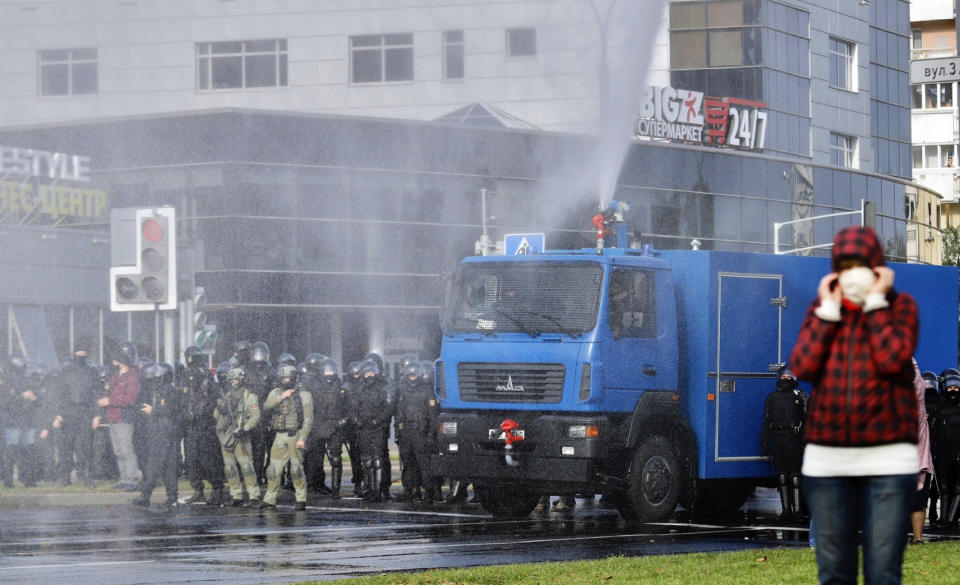 Police use a water cannon against demonstrators during a rally in Minsk, Belarus, Sunday, Oct. 4, 2020. Hundreds of thousands of Belarusians have been protesting daily since the Aug. 9 presidential election. (AP Photo)