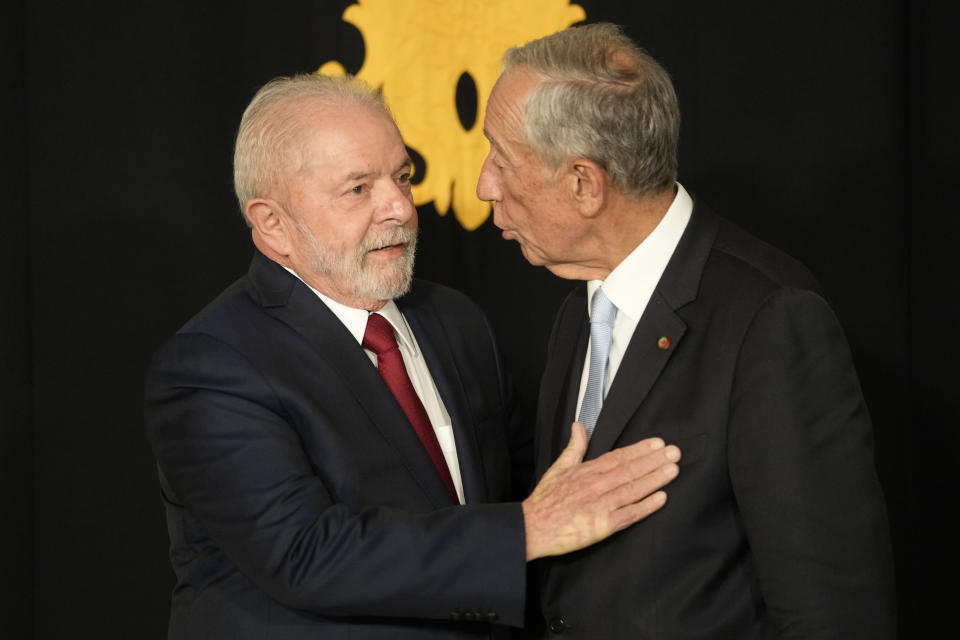 Portuguese President Marcelo Rebelo de Sousa, right, chats with Brazil president-elect Luis Inacio Lula da Silva as he arrives at the Belem Presidential palace in Lisbon, Friday, Nov. 18, 2022. Lula arrived in Lisbon Friday to meet with Rebelo de Sousa and later with Prime Minister Antonio Costa. (AP Photo/Armando Franca)