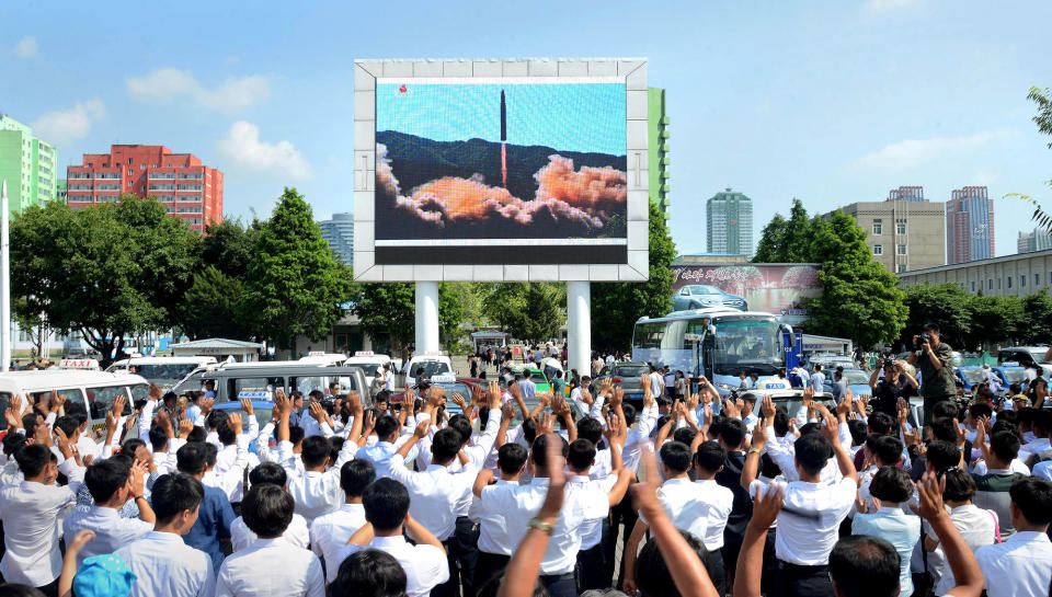 <p>JUL. 5, 2017 – People watch a huge screen showing the test launch of intercontinental ballistic missile Hwasong-14 in this undated photo released by North Korea’s Korean Central News Agency (KCNA). (Photo: KCNA/via Reuters) </p>