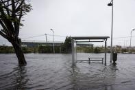 <p>A flooded road and a bus stop are pictured on Boulevard Chanzy in downtown Pointe-a-Pitre on Sept. 19, 2017 in the French territory of Guadeloupe after the passage of Hurricane Maria. (Photo: Cedrick Isham Calvados/AFP/Getty Images) </p>