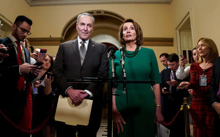 Senate Minority Leader Chuck Schumer (D-NY) and House Minority Leader Nancy Pelosi (D-CA) speak to the media ahead of a possible partial government shut down in Washington, U.S., December 20, 2018. REUTERS/Joshua Roberts