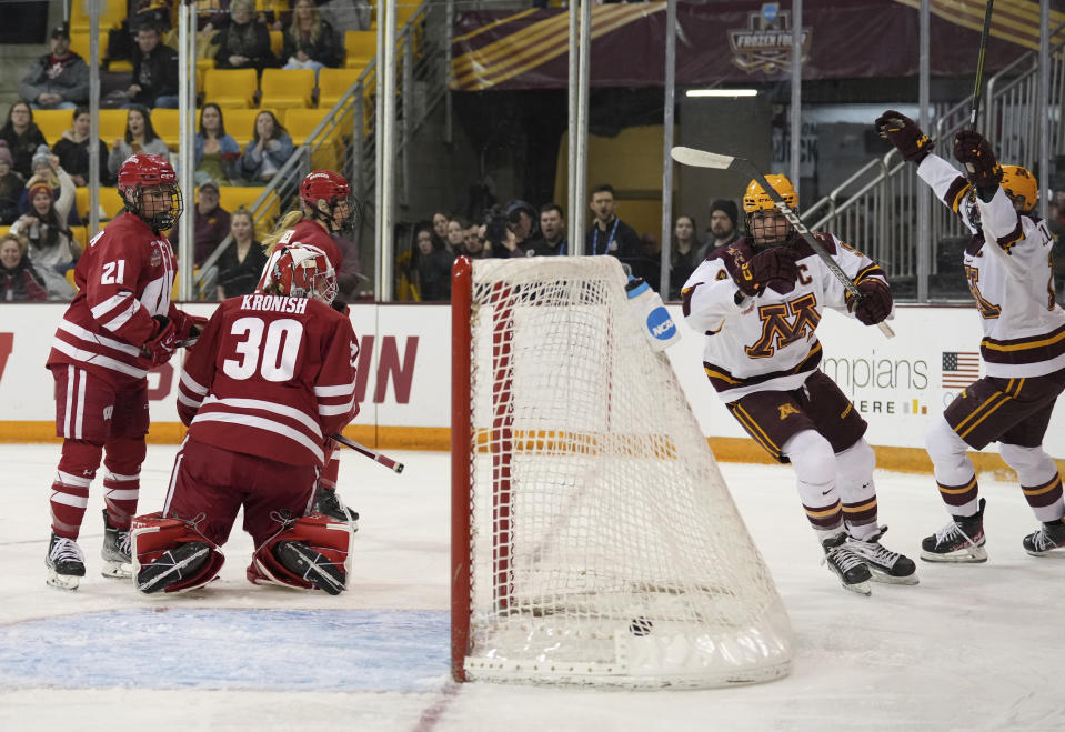 Minnesota forward Taylor Heise, second from right, celebrates after scoring during the first period of an NCAA Frozen Four semifinal against Wisconsin in Duluth, Minn., Friday, March 17, 2023. (Shari L. Gross/Star Tribune via AP)