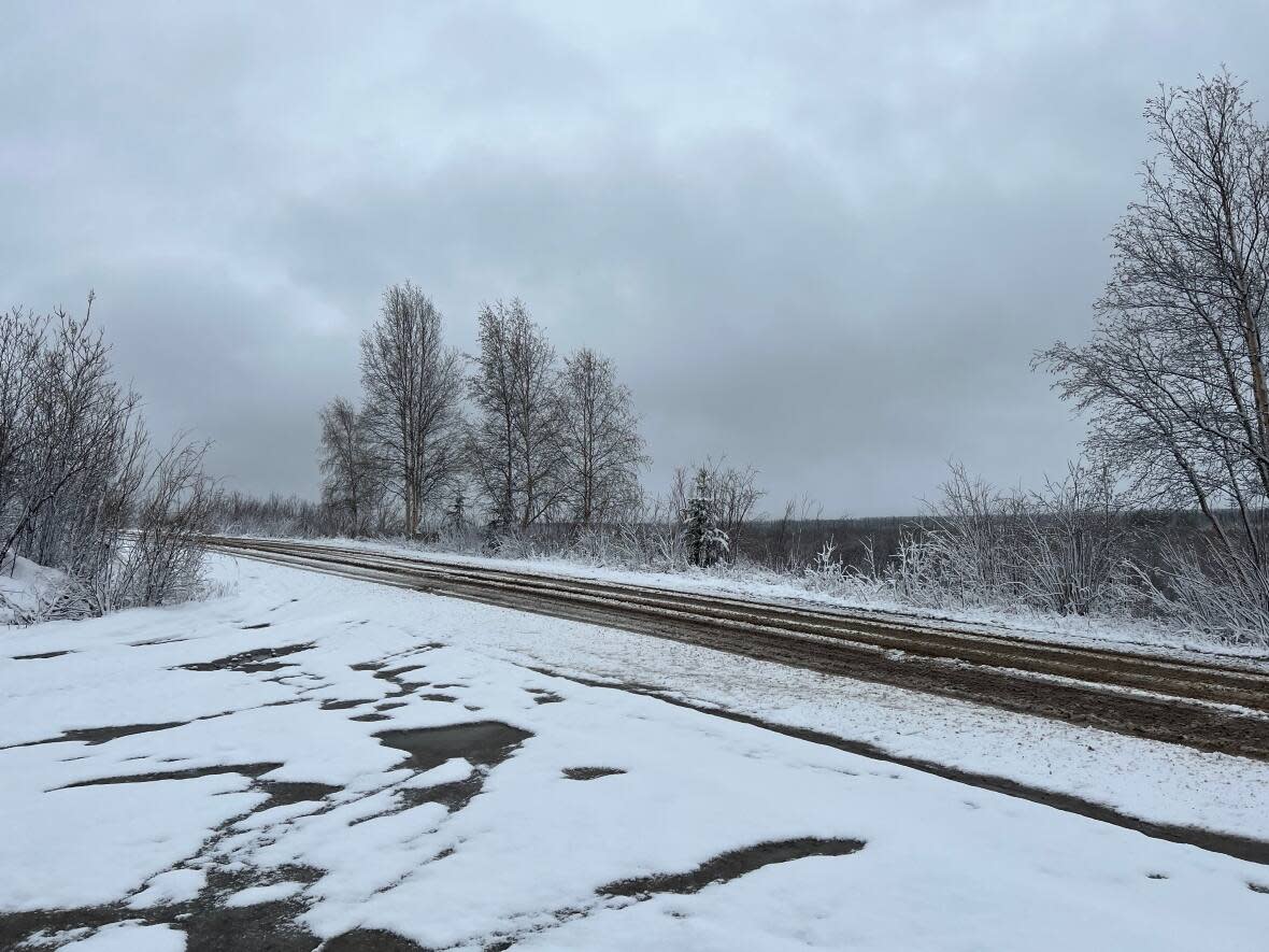 Fort McPherson, N.W.T., was dusted in snow Wednesday. Resident Mary Teya says though the community gets snow in the spring from time to time, this snow dump is 'unusual.' (William Firth/CBC - image credit)