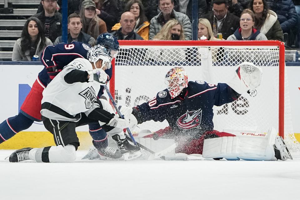 Dec 5, 2023; Columbus, Ohio, USA; Columbus Blue Jackets goaltender Elvis Merzlikins (90) saves a shot from Los Angeles Kings center Quinton Byfield (55) with defensive help from Columbus Blue Jackets defenseman Ivan Provorov (9) during the first period of the NHL game at Nationwide Arena.