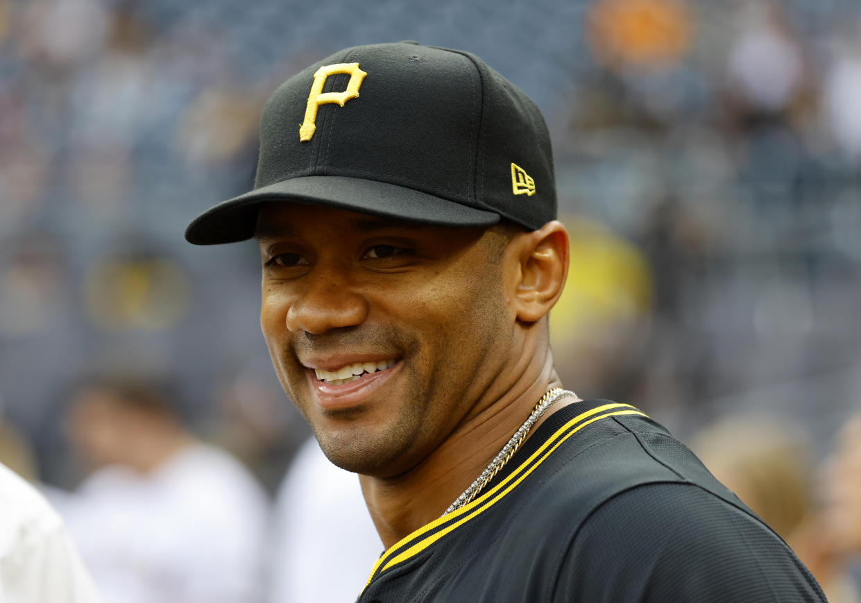 Russell Wilson threw out the first pitch of a Pittsburgh Pirates game this month. (Photo by Justin K. Aller/Getty Images)