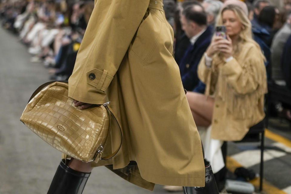 A model wears a creation as part of the Tod's women's Fall-Winter 2024-25 collection presented in Milan, Italy, Friday, Feb. 23, 2024. (AP Photo/Luca Bruno)