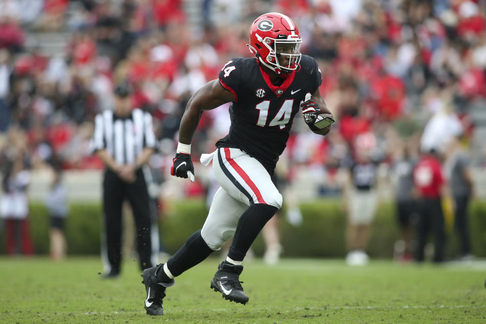 FILE - Georgia wide receiver Arik Gilbert runs a route in the first half of Georgia's spring NCAA college football game, Saturday, April 16, 2022, in Athens, Ga. Nebraska college football tight end Arik Gilbert, who transferred from Georgia and was awaiting a ruling on his eligibility from the NCAA, was arrested on suspicion of burglary in Lincoln, Neb., early Tuesday, Aug. 29, 2023, after police received a report of a store break-in. (AP Photo/Brett Davis, File)