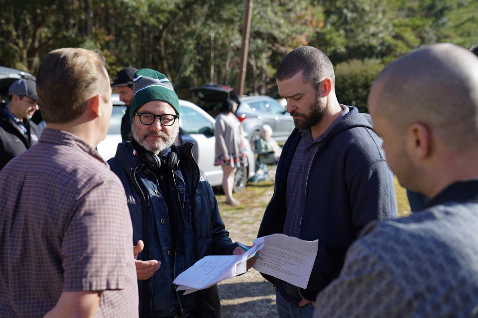 This image released by Apple shows director Fisher Stevens, second left, and Justin Timberlake on the set of “Palmer.” (Apple via AP)
