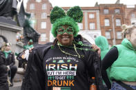 Torianna Fletcher from Detroit poses for a photo ahead of the St Patrick's Day Parade in Dublin, Friday March 17, 2023. (Brian Lawless/PA via AP)